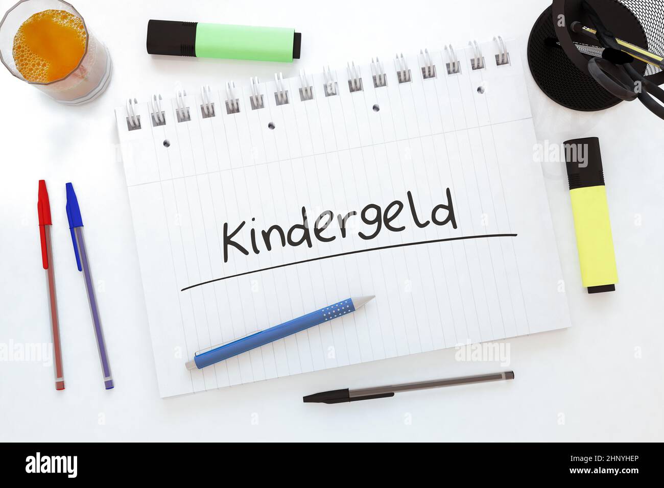 Kindergeld - german word for child benefit or allowance - handwritten text in a notebook on a desk - 3d render illustration. Stock Photo