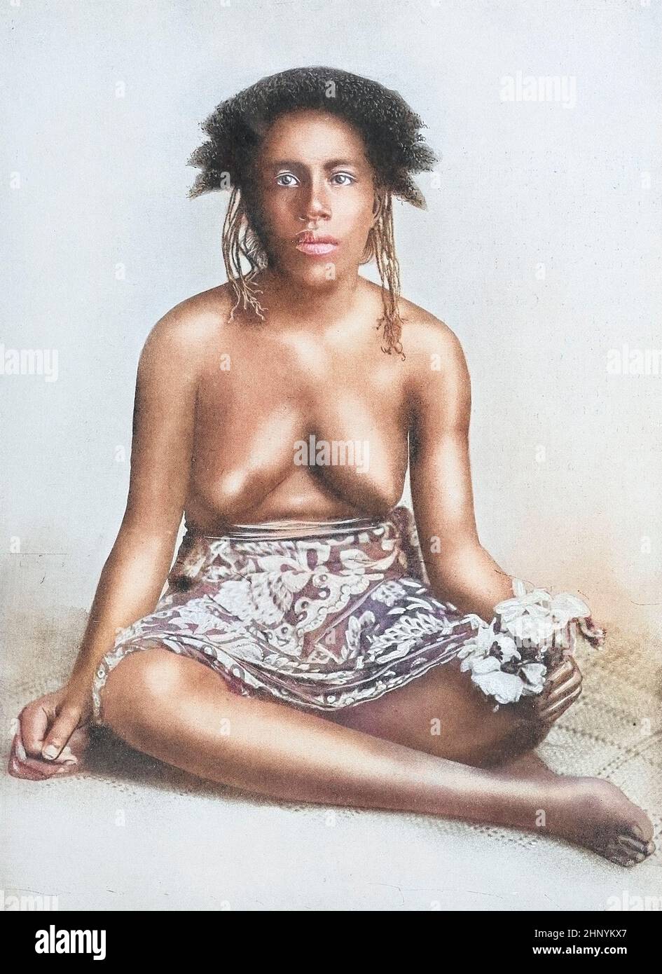 Machine Colourised A Solomon Islands woman (Fijian type) in native dress from The living races of mankind : a popular illustrated account of the customs, habits, pursuits, feasts & ceremonies of the races of mankind throughout the world Volume 1 by Sir Harry Hamilton Johnston, Henry Neville Hutchinson, Richard Lydekker and Dr. A. H. Keane published London : Hutchinson & Co. 1902 Stock Photo