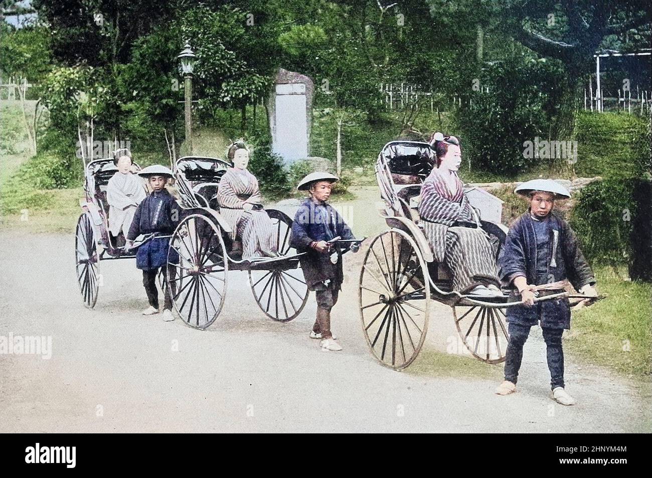 Machine Colorized Japanese Ladies in jinrickshaws Drawn by Coolies from The living races of mankind : a popular illustrated account of the customs, habits, pursuits, feasts & ceremonies of the races of mankind throughout the world Volume 1 by Sir Harry Hamilton Johnston, Henry Neville Hutchinson, Richard Lydekker and Dr. A. H. Keane published London : Hutchinson & Co. 1902 Stock Photo