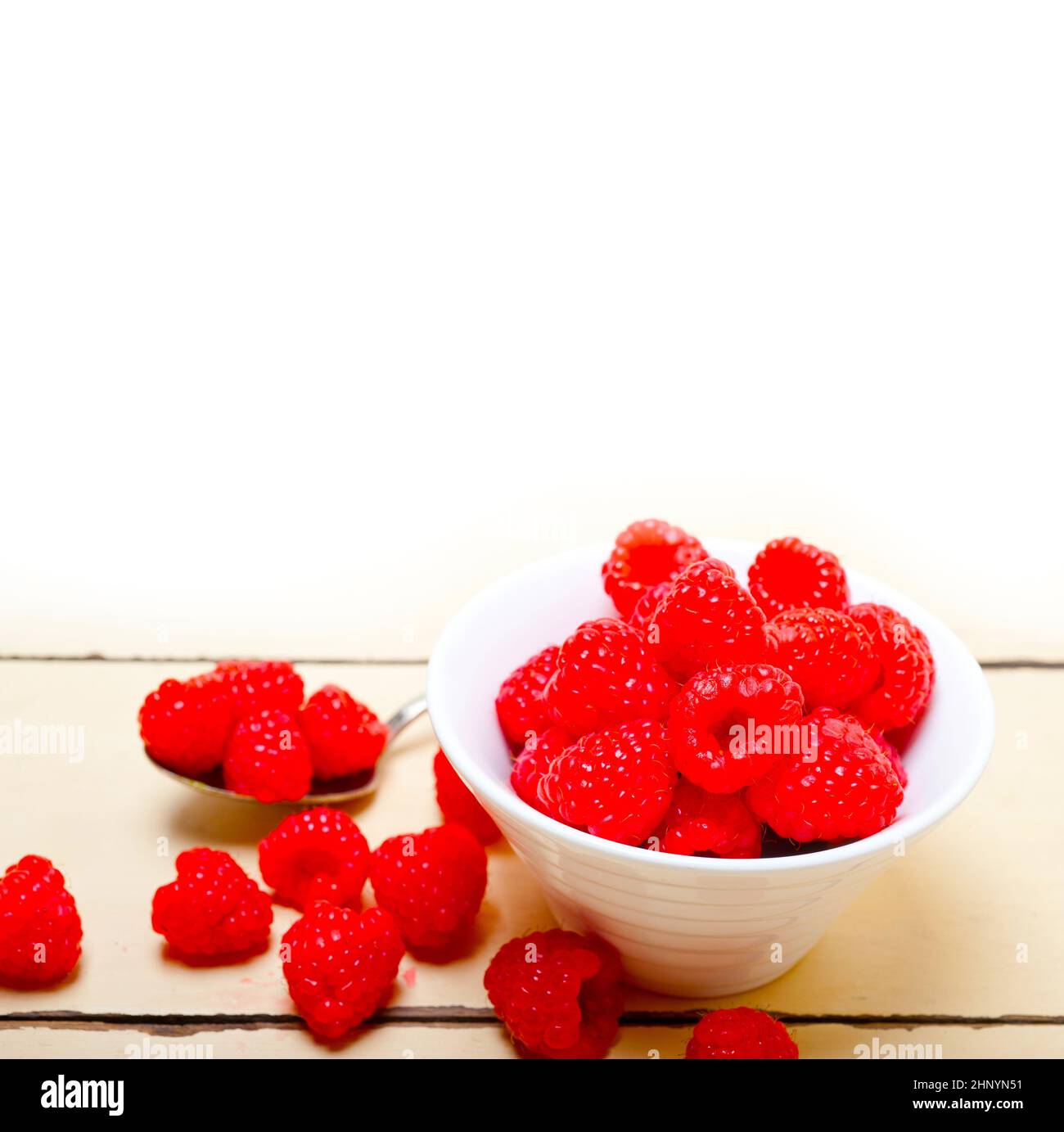 One Raspberry On A Table bunch of fresh raspberry on a bowl and white wood rustic table Stock ...