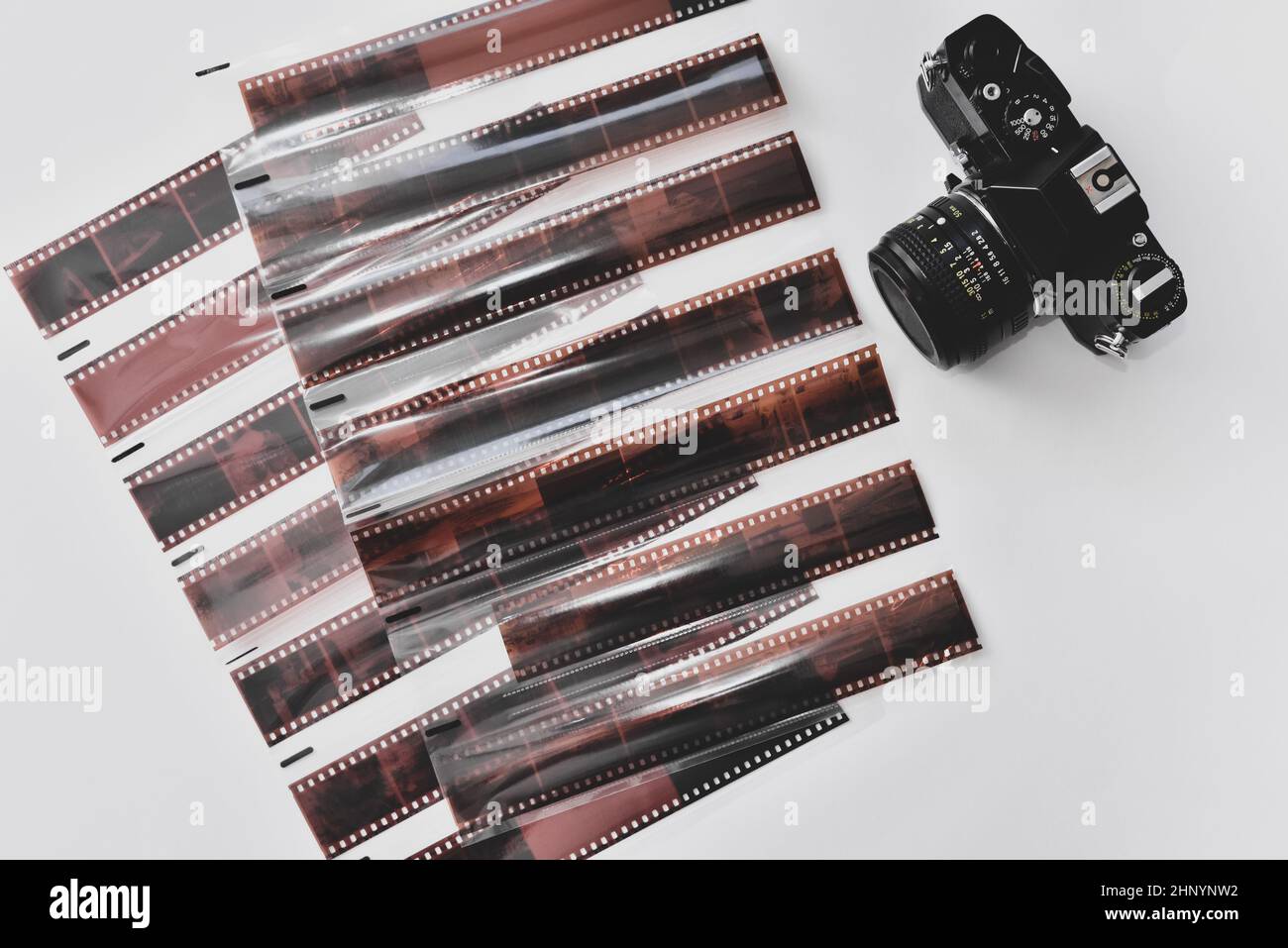 Top view of 35mm films negatives in protective sleeves and vintage