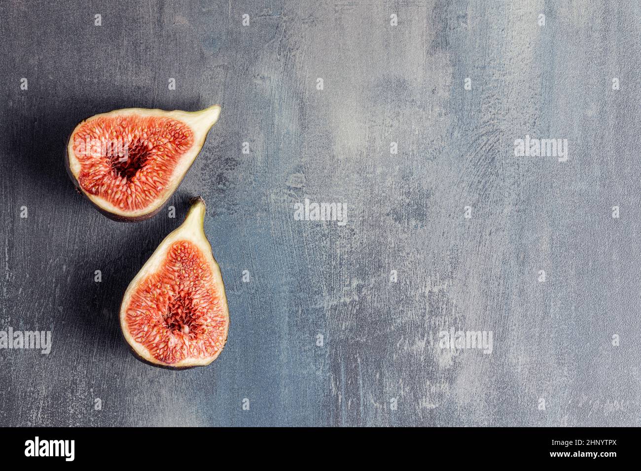 Fresh ripe figs on kitchen table. Top view. Stock Photo