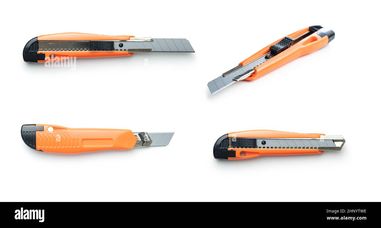 Plastic orange utility knife isolated on white background. Stock Photo