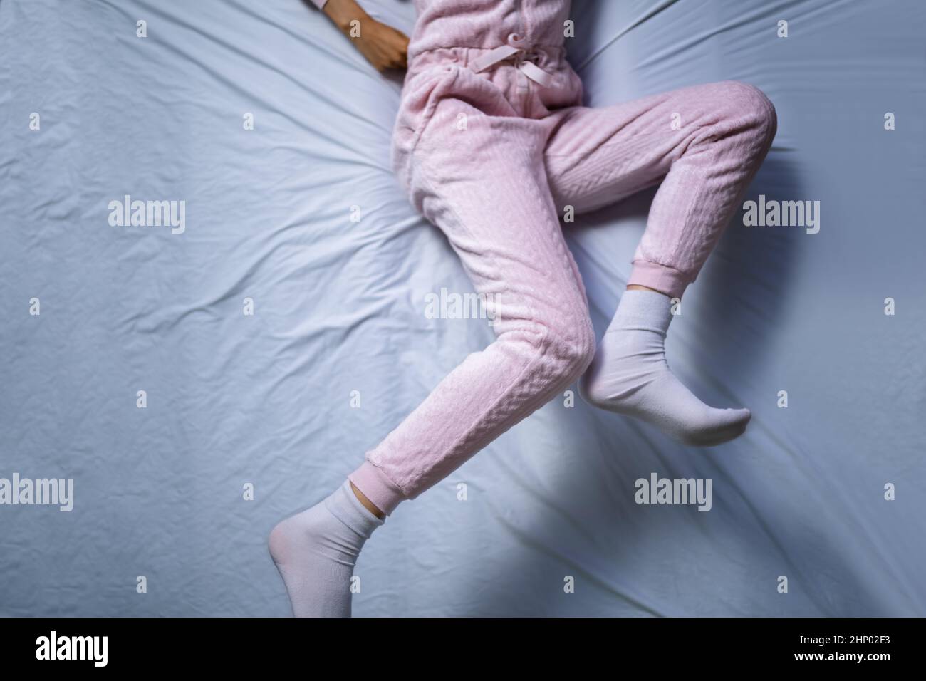 African American Woman With RLS Restless Legs Syndrome. Sleeping In