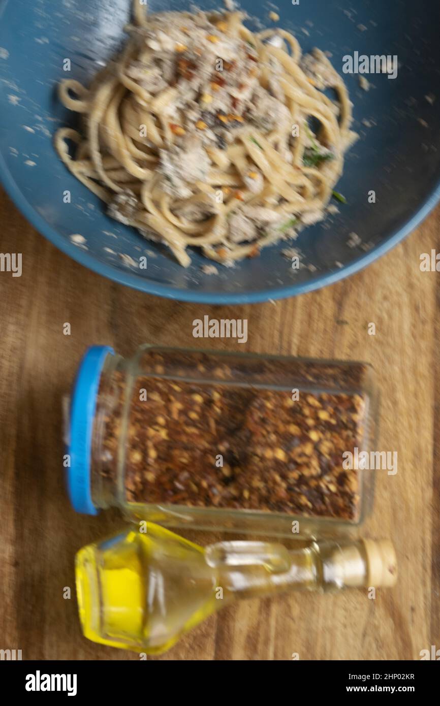 spaghetti with oil anchovies fillets and hot chili Stock Photo Alamy