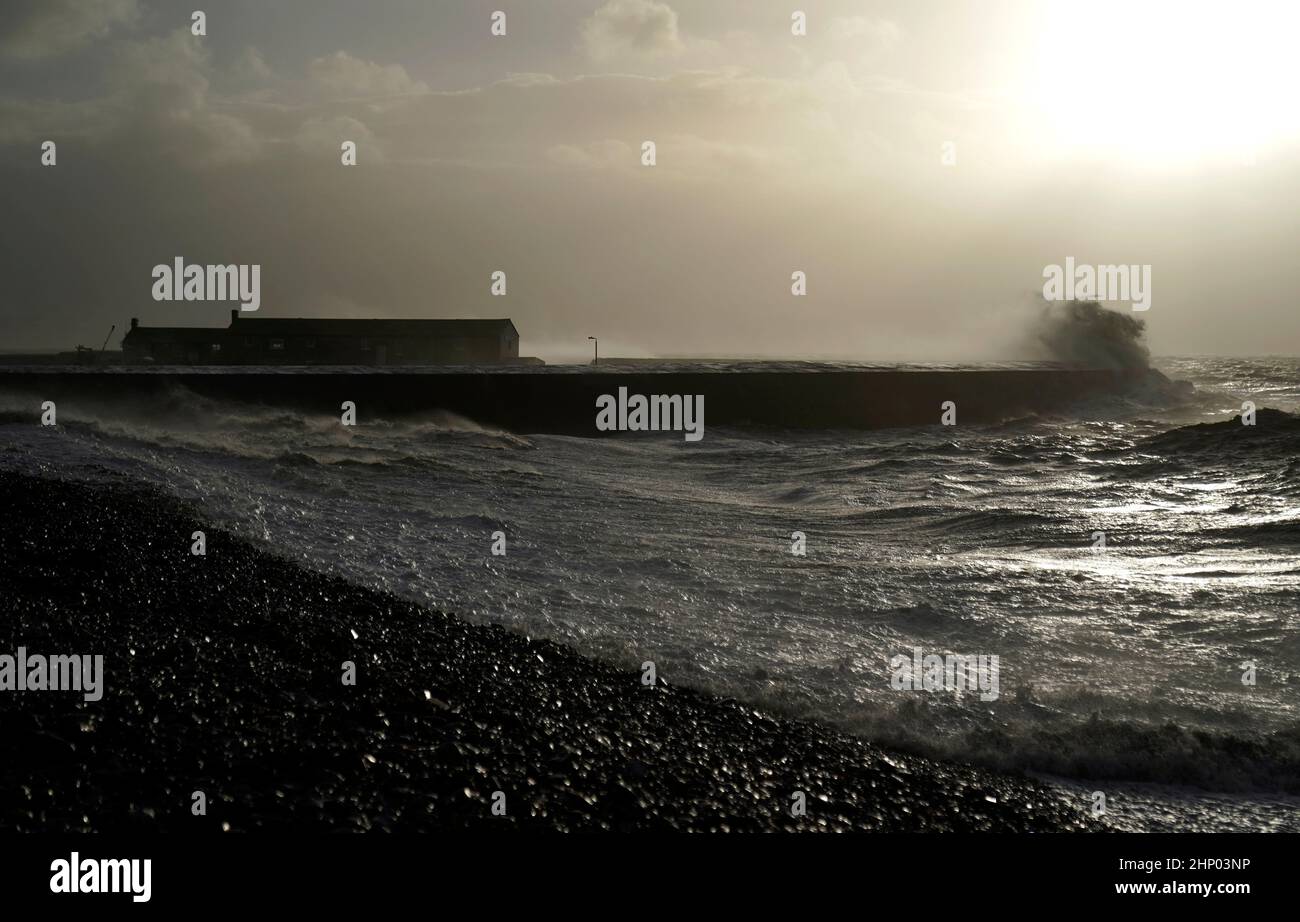 Waves crash against the Cobb in Lyme Regis, west Dorset, as Storm