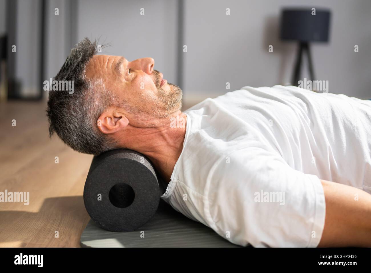 Foam Roller Healthy Neck Workout Sport Training On Floor Stock Photo