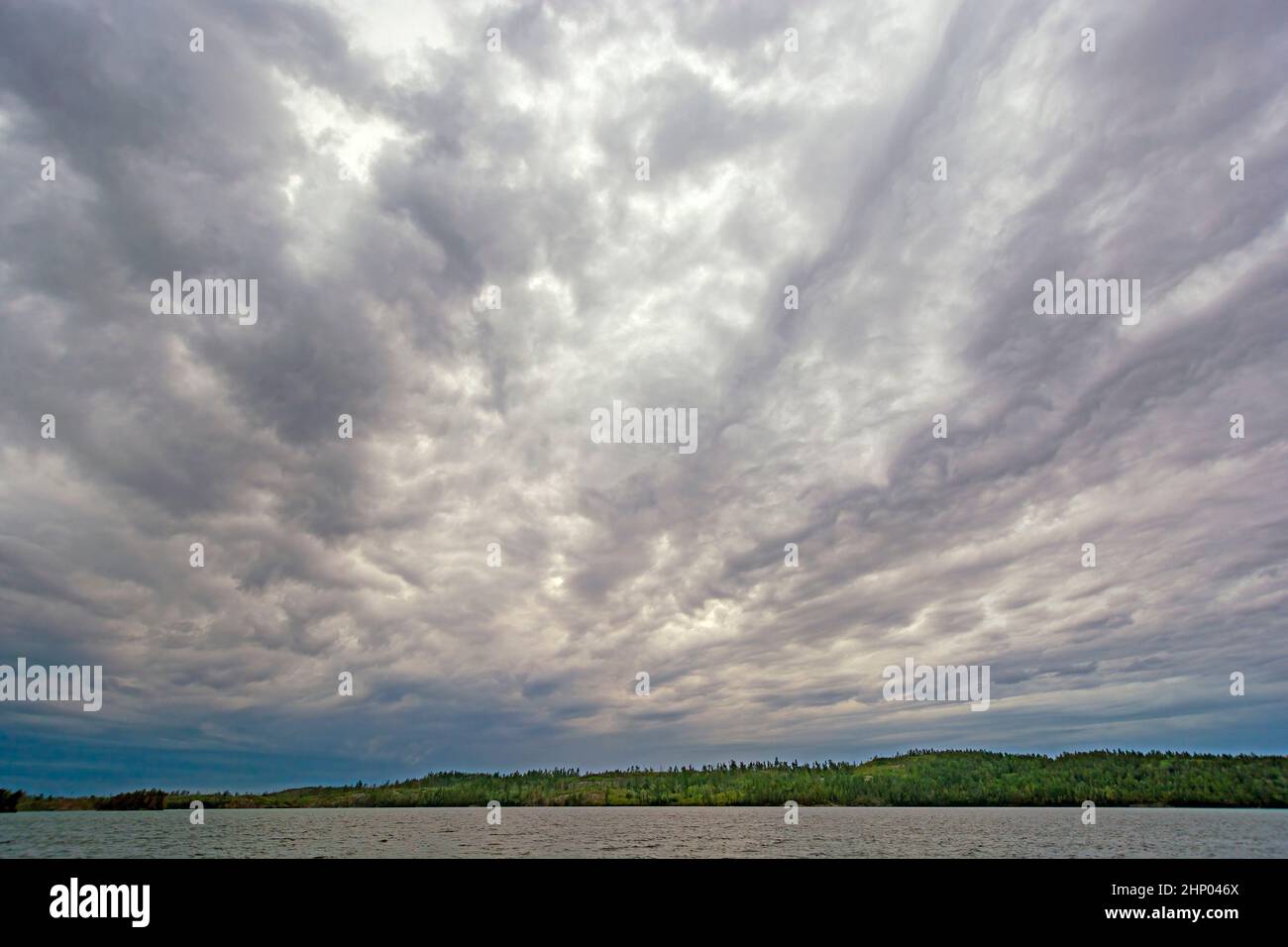 Looming Stratus Clouds Over a Wilderness Lake on Knife Lake in the Boundary waters in Minnesota Stock Photo