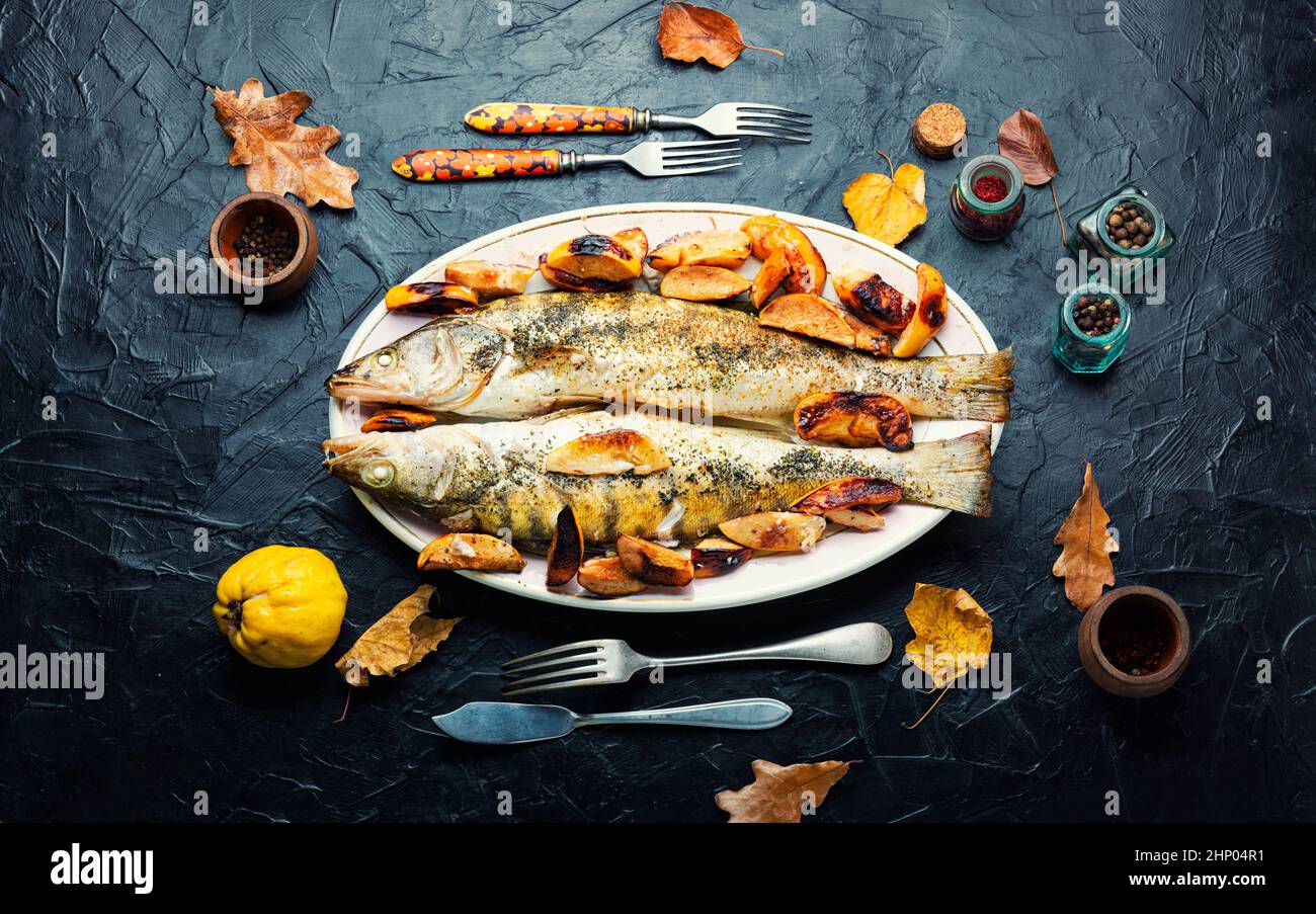 Fish pike perch grilled with quince and apple Stock Photo Alamy