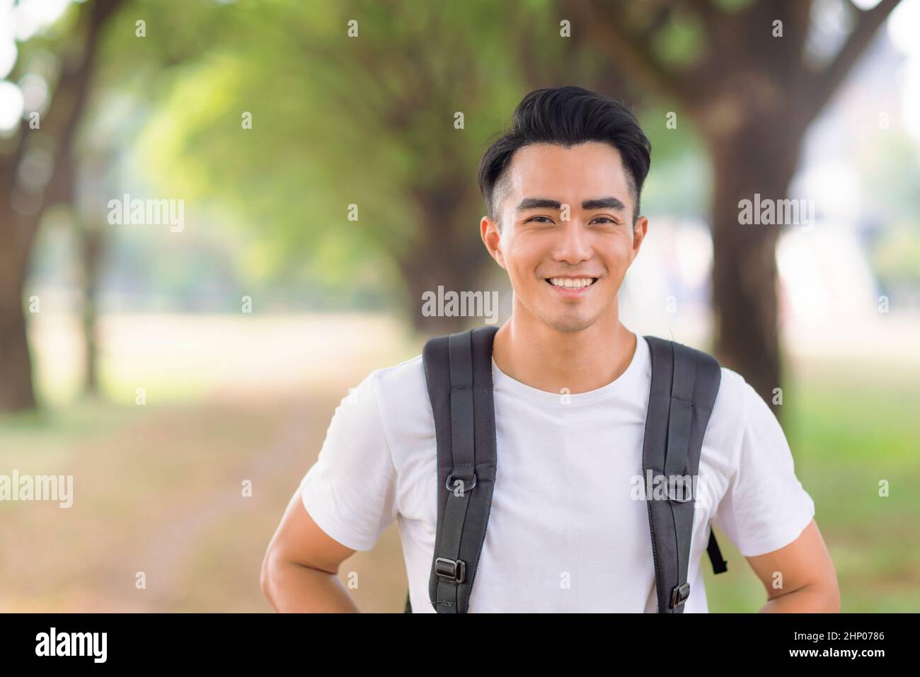 Smiling young man looking at camera Stock Photo