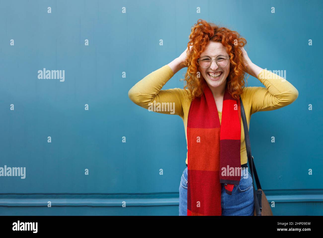 Funny curly woman fooling around and having a blast Stock Photo