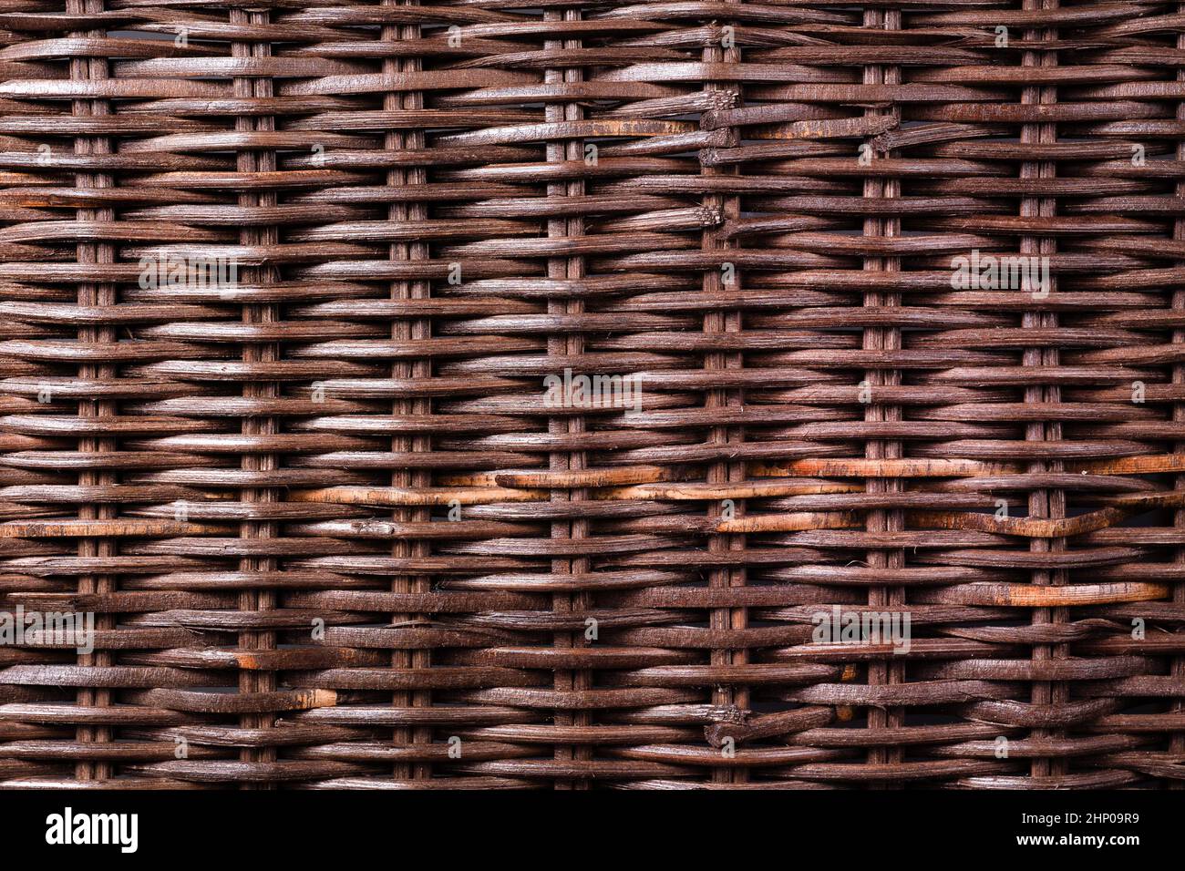 dark wicker wooden background. Weaving and hard work from natural resources components and environmentally friendly raw materials Stock Photo