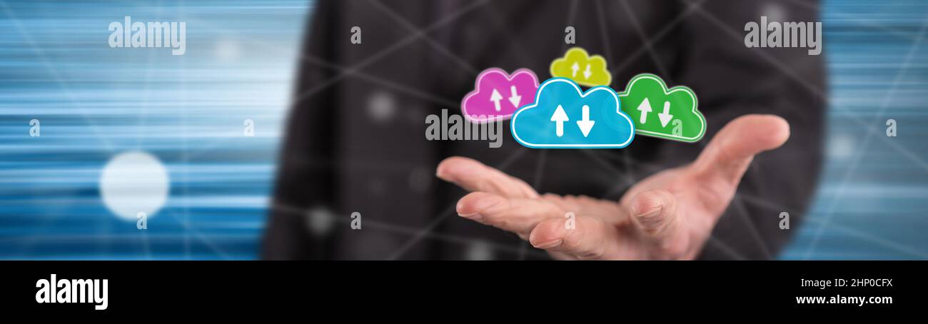 Cloud storage concept above the hand of a man in background Stock Photo ...