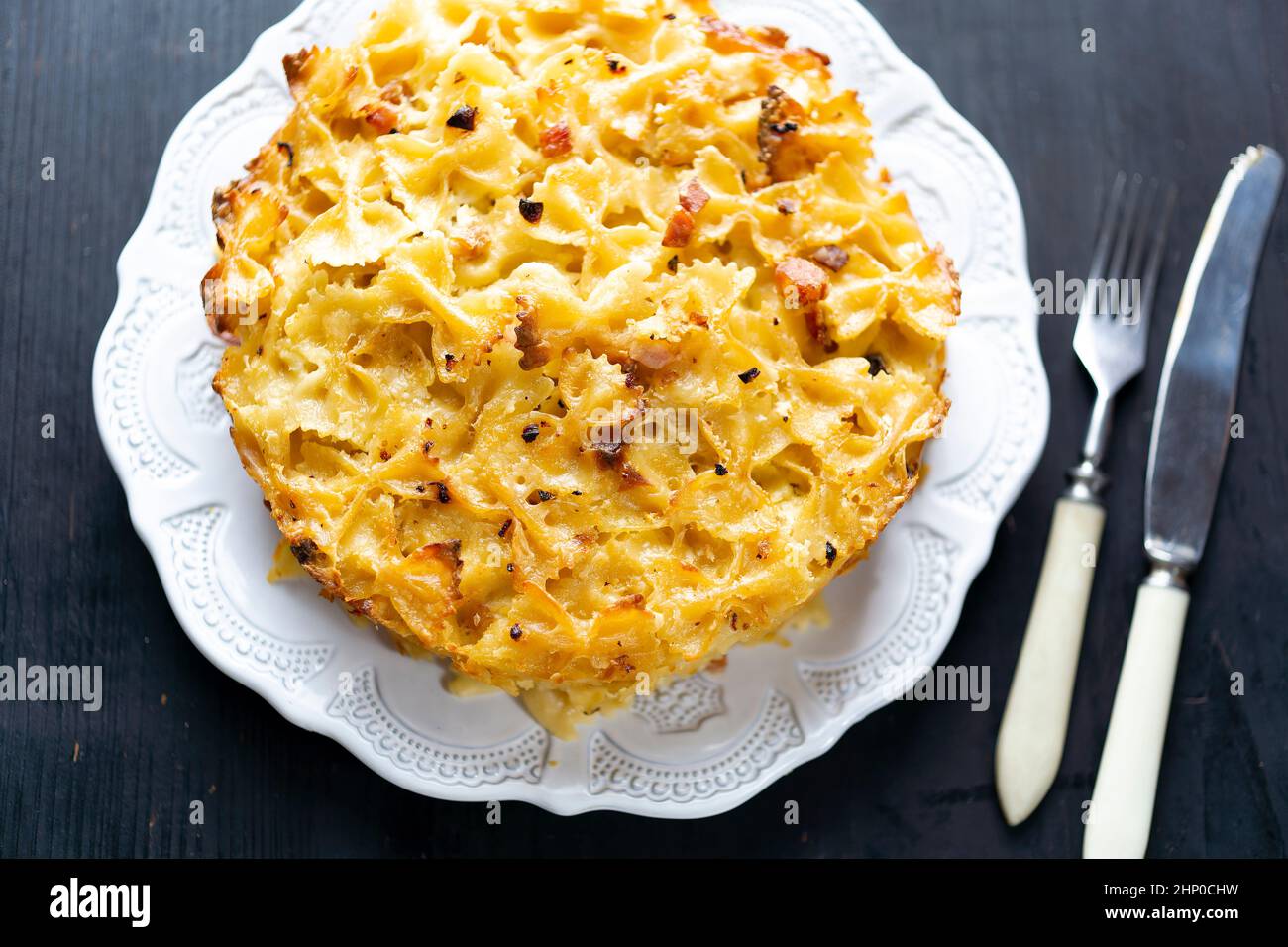 close up of italian american baked farfalle bow pasta in bechamel sauce Stock Photo