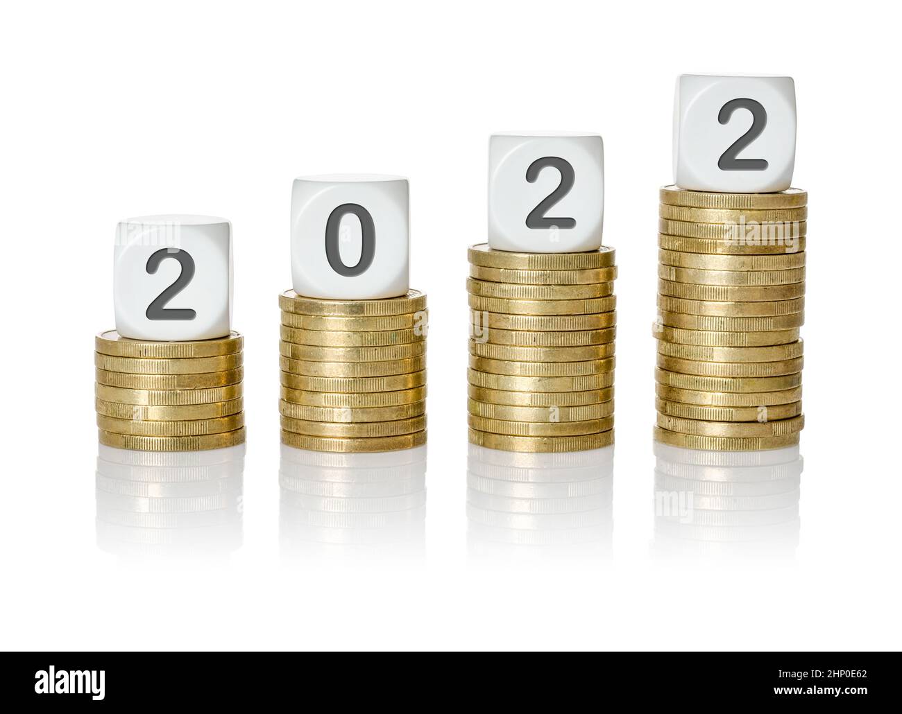 Rising coin stacks with letter dice - 2022 Stock Photo