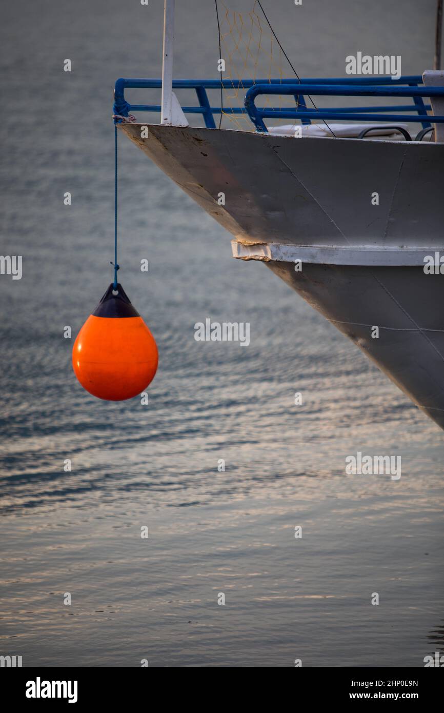 Orange mooring buoy hanging from a ship Stock Photo Alamy