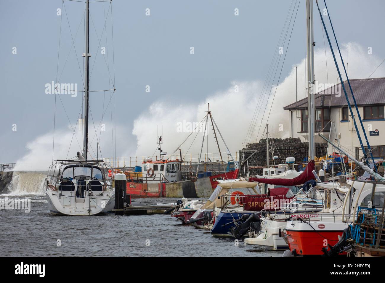 Aberystwyth, Ceredigion, Wales, UK. 18th February 2022 UK Weather: Storm Eunice and rough seas bring huge crashing waves along Aberystwyth promenade and sea defences this morning . © Ian Jones/Alamy Live News Stock Photo
