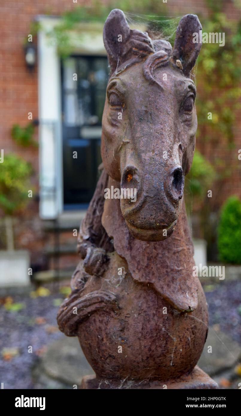 horse's head sculpture on front garden wall, suffolk, england Stock