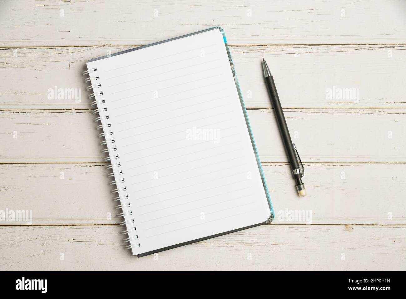 Keyboard Over A Table Beside A Notebook And Pens With Sticky Notes Stock Photo