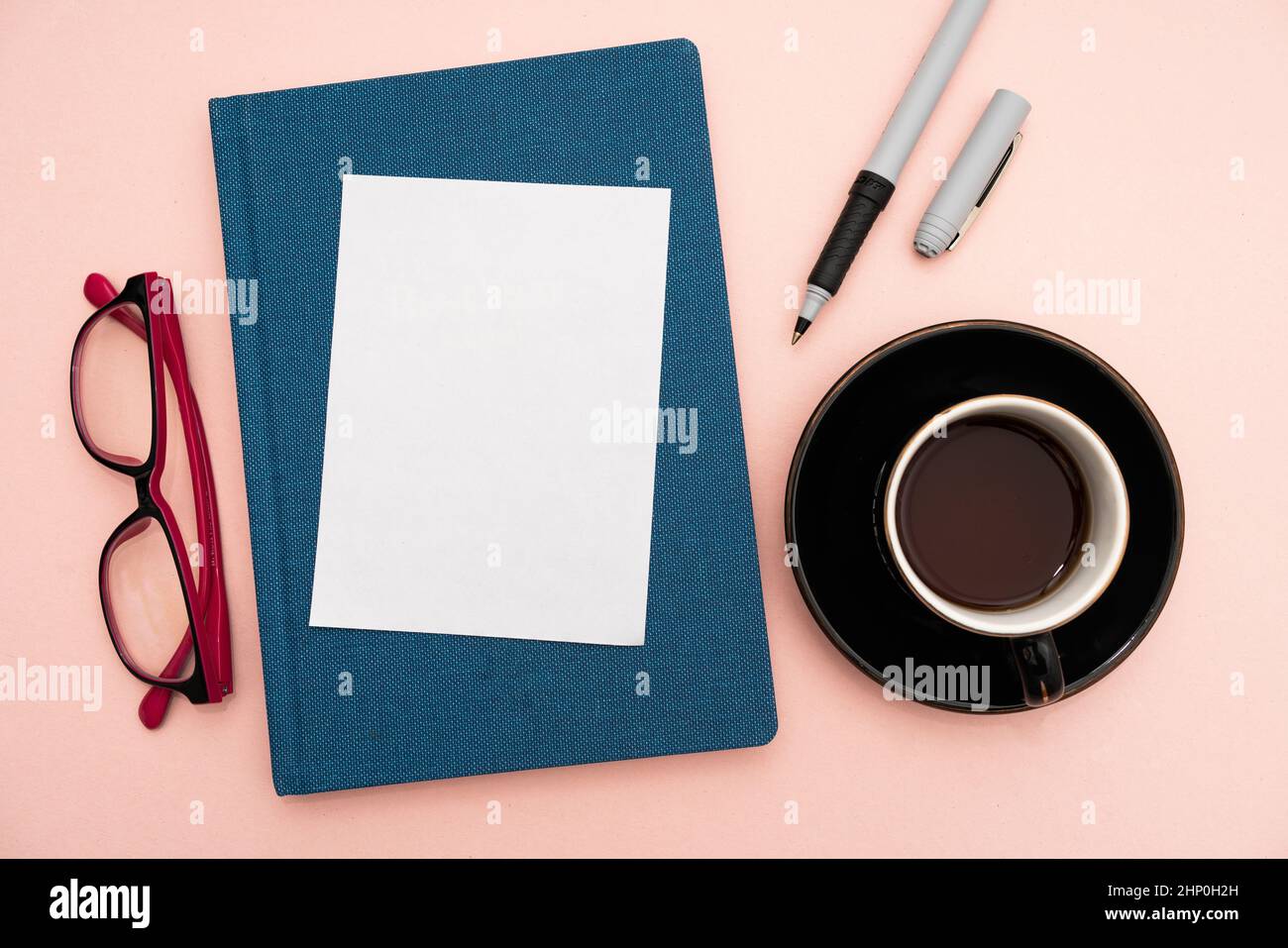 Office Supplies Over Desk With Keyboard And Glasses And Coffee Cup For
