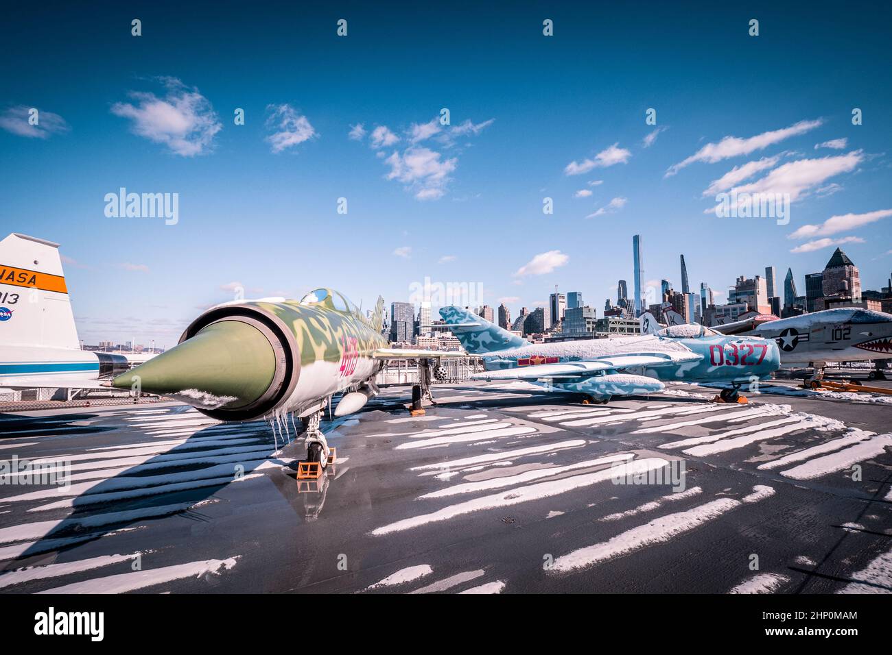 During the cold war defected MiGs on display on the flight deck of USS Intrepid Sea, Air and Space Museum in NYC, NY, USA Stock Photo