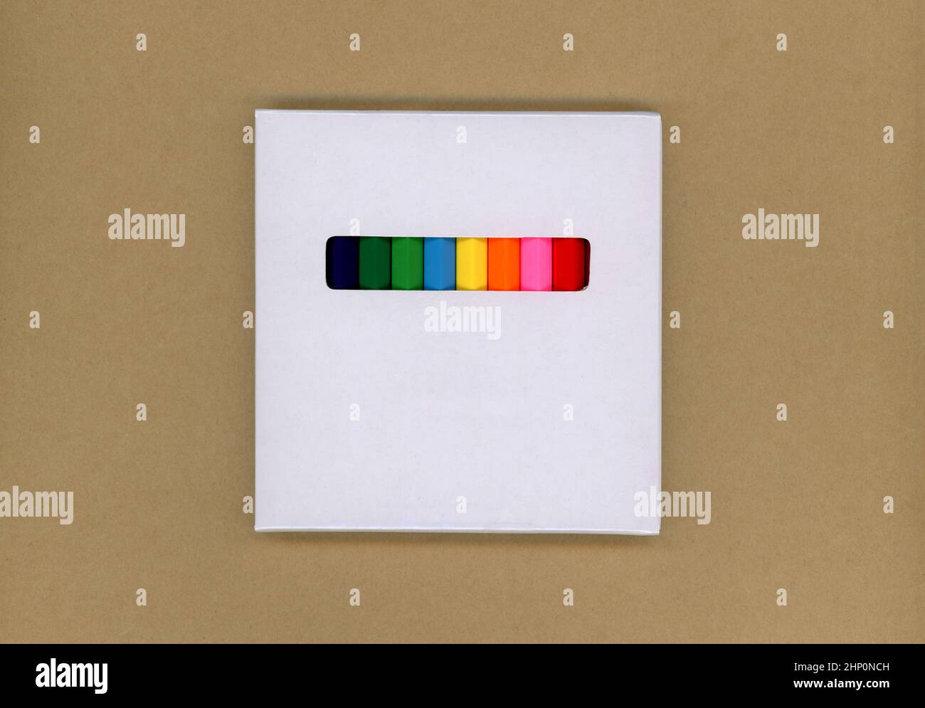 Colored pencils in a white cardboard box Stock Photo