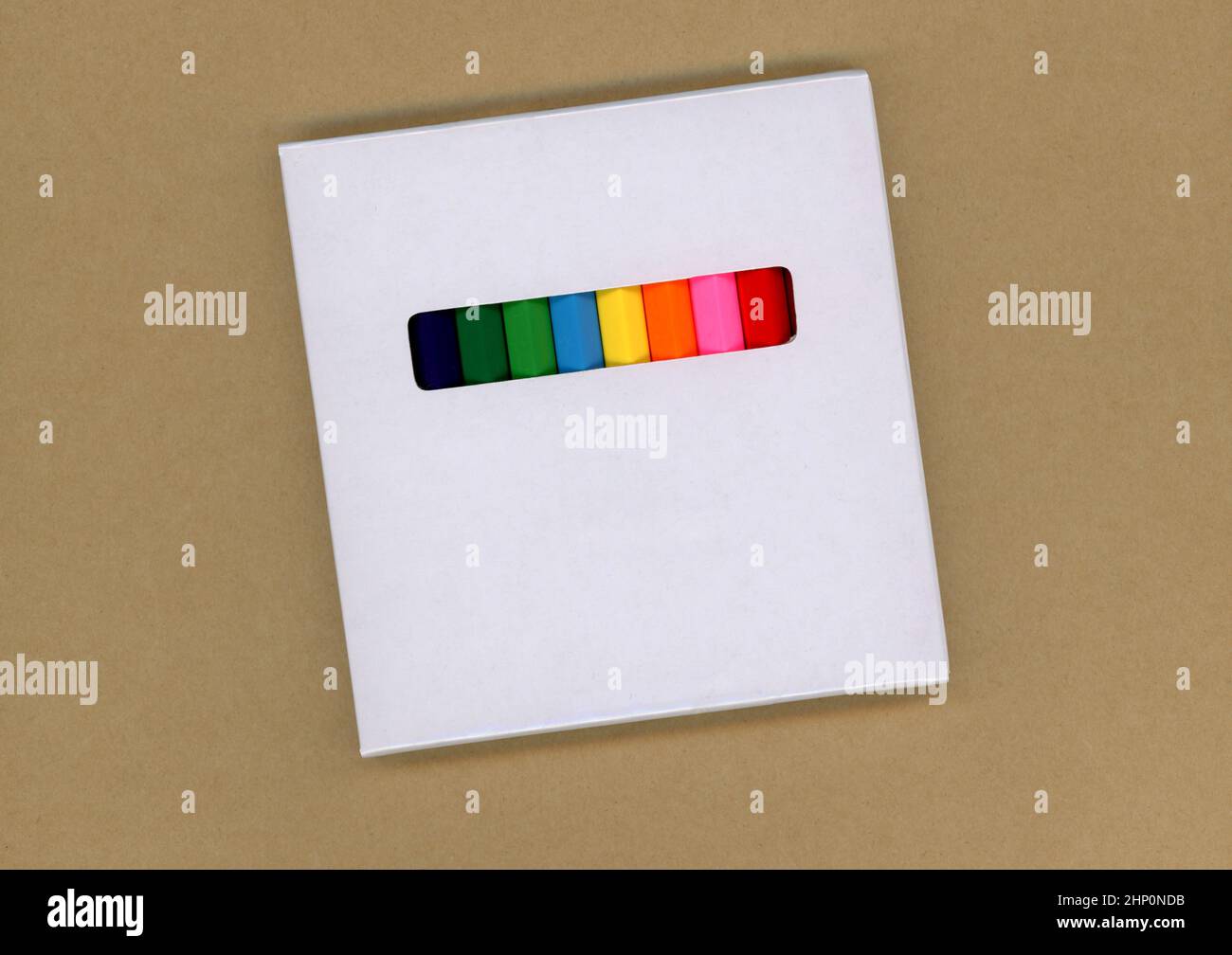Colored pencils in a white cardboard box Stock Photo