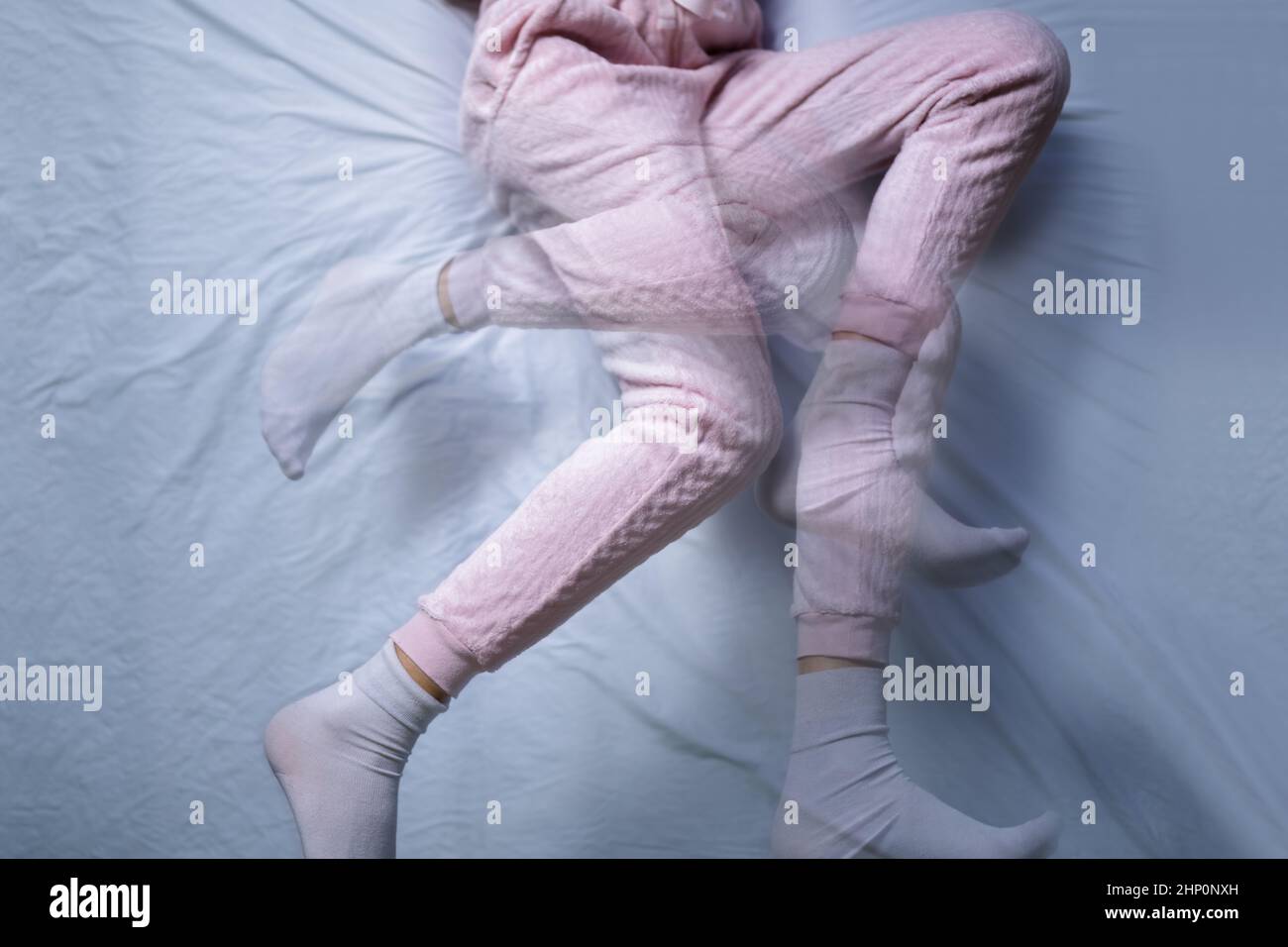 African American Woman With RLS Restless Legs Syndrome. Sleeping In