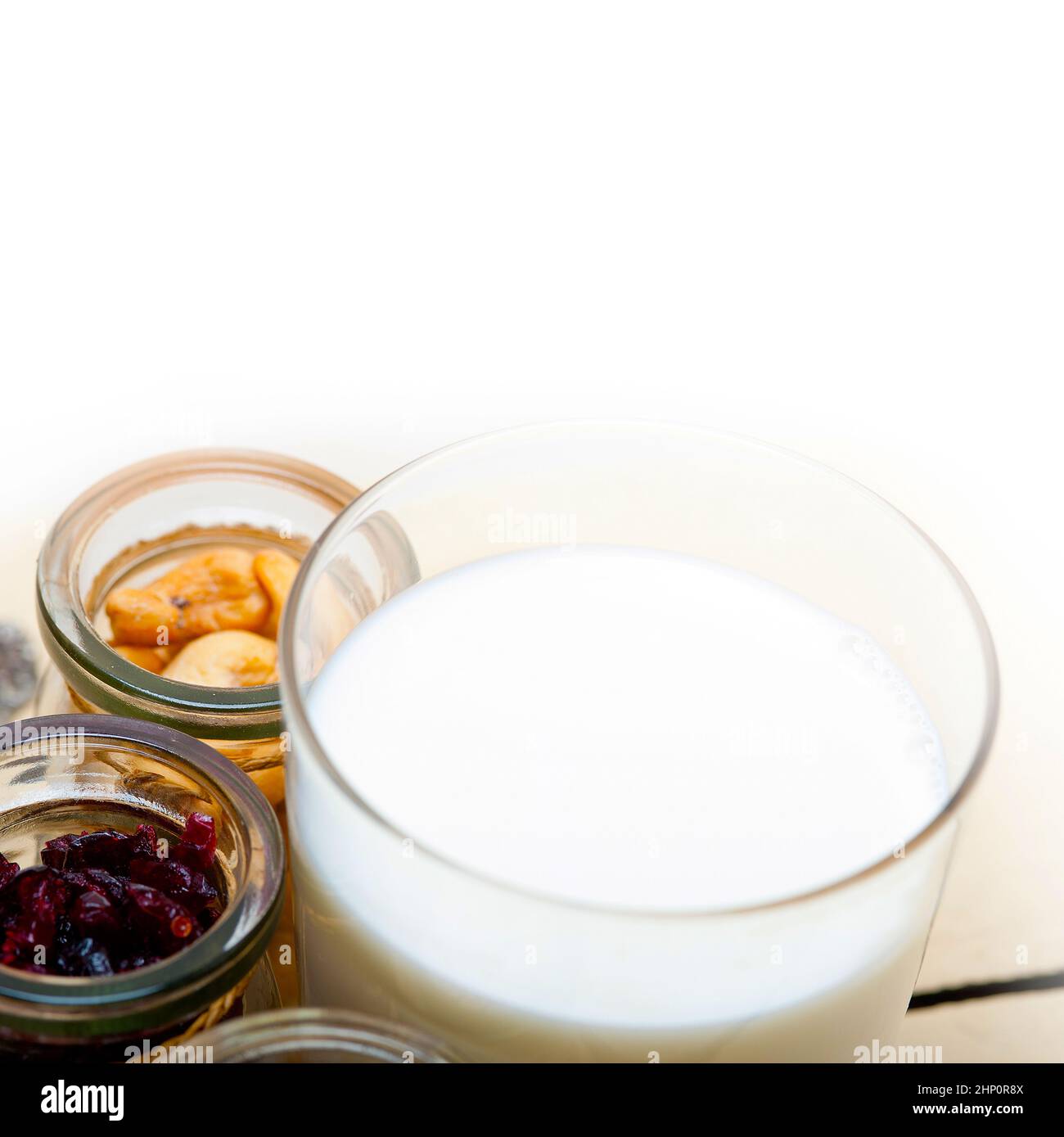 healthy breakfast ingredients milk oat cashew nuts dried cramberry