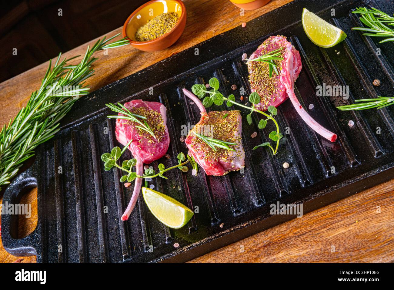 Seasoned and Herb Marinated Raw Lamb Chops Stock Photo - Alamy