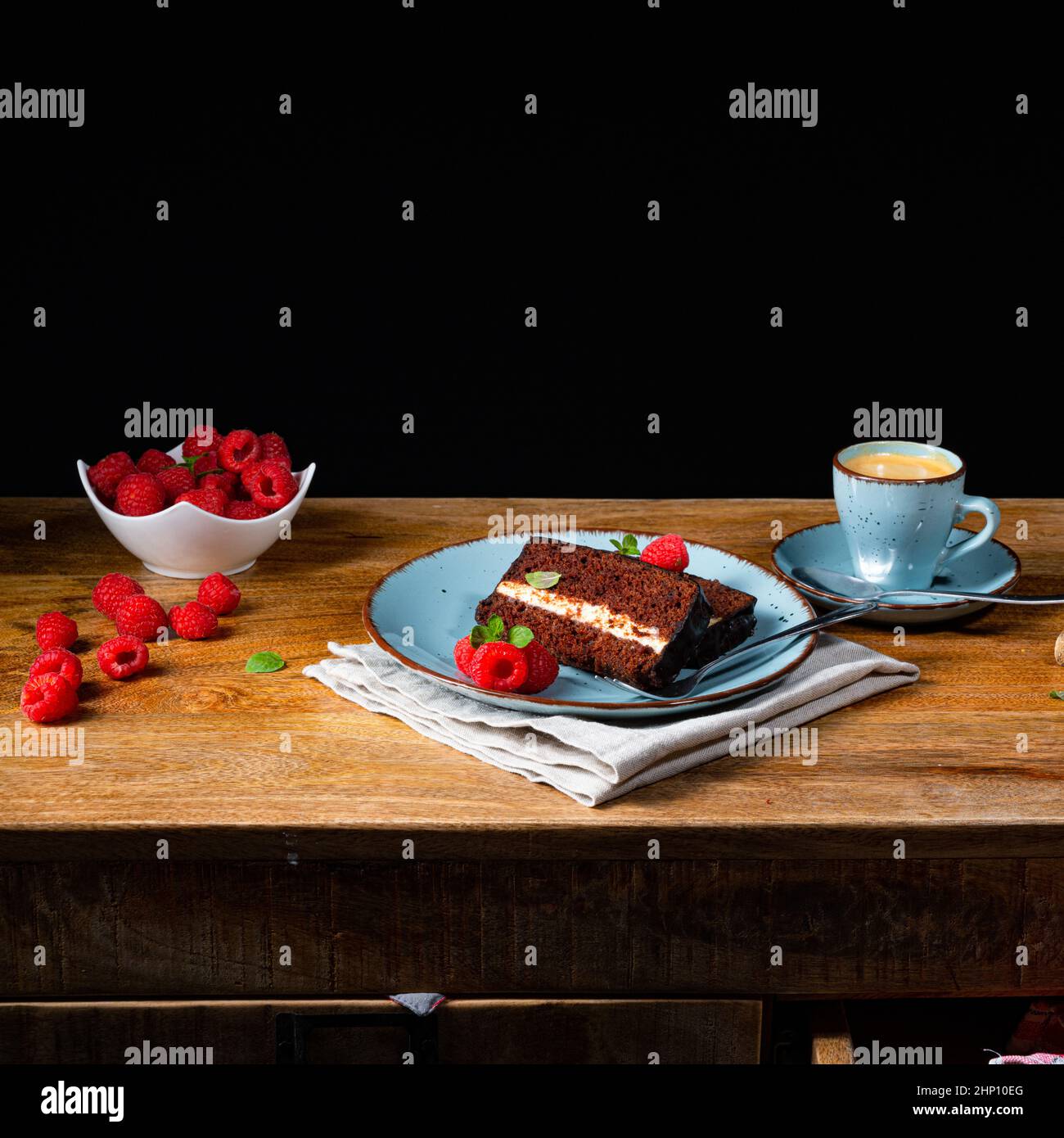 Rustic chocolate cake with raspberries and coffee Stock Photo