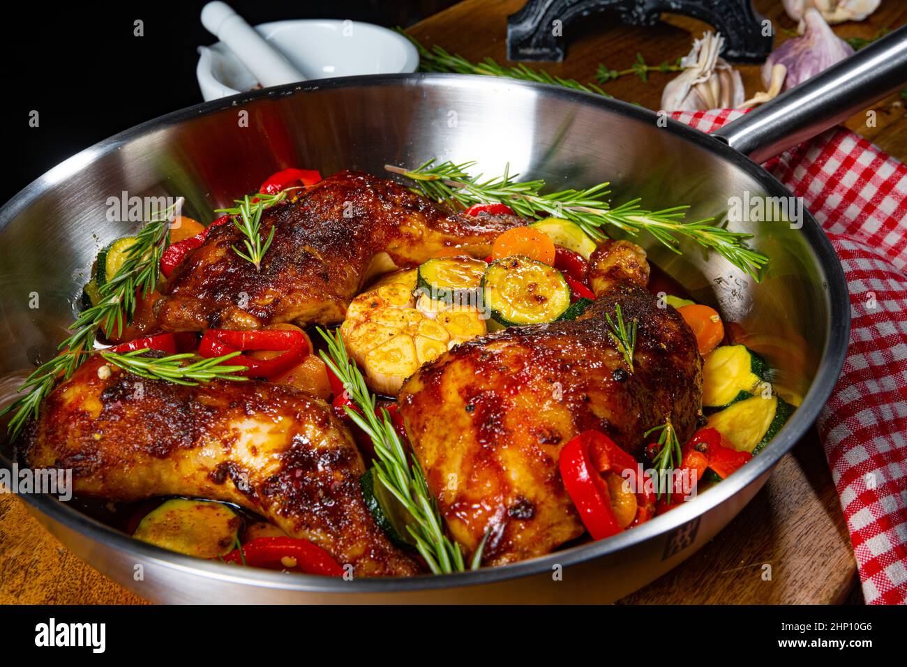 Fried chicken legs with various vegetables and spices Stock Photo