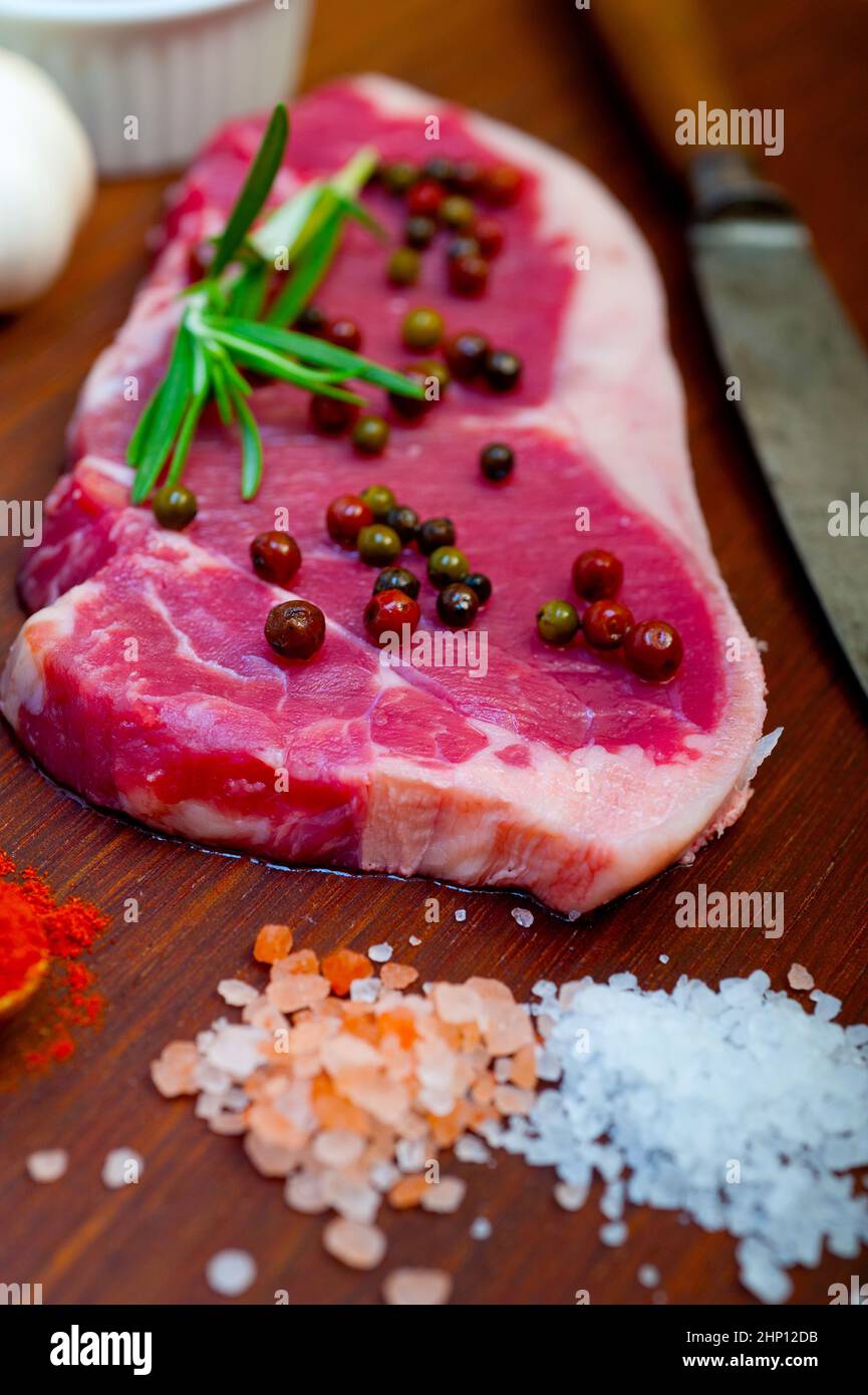 raw uncooked ribeye beef steak butcher selection Stock Photo Alamy