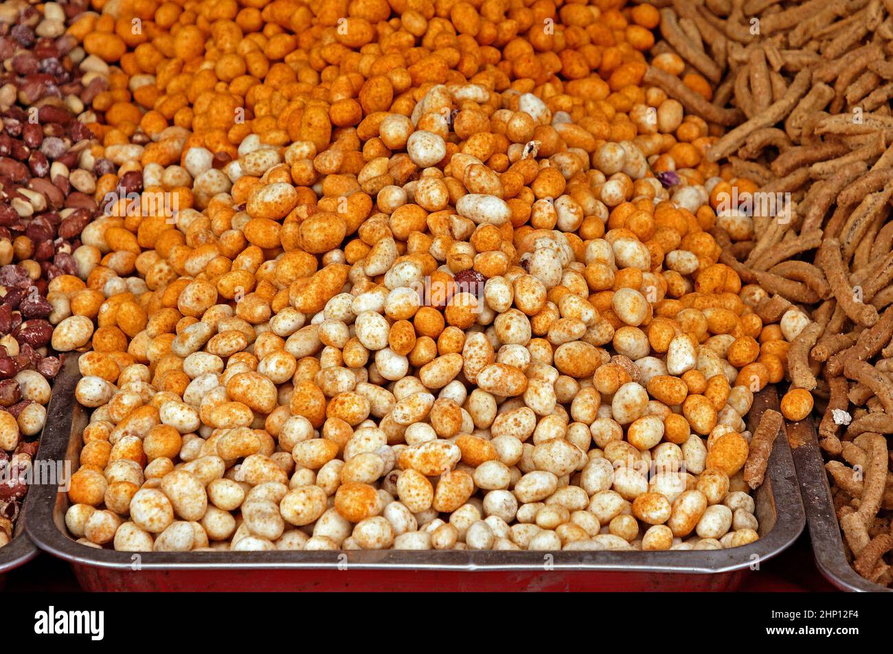 Pile of healthy snacks of mixed nuts sold on street market stall Stock