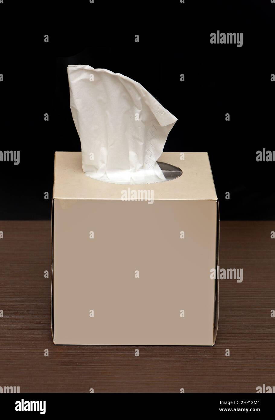 Box of paper tissues on shelf with one sticking from the top Stock Photo