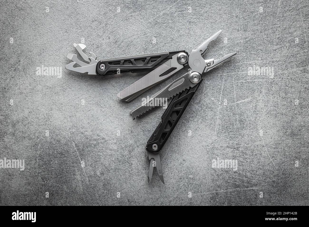 Multitools pliers with other tools and knife. Multifunction pliers