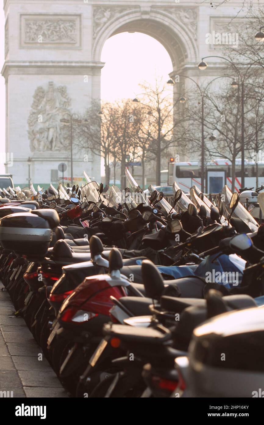 Motorcycles standing at the Parking lot. In the background are the