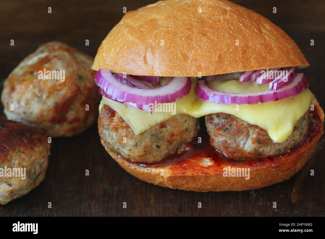 Homemade Spicy Meatball Sub Sandwich with Marinara Sauce and Cheese