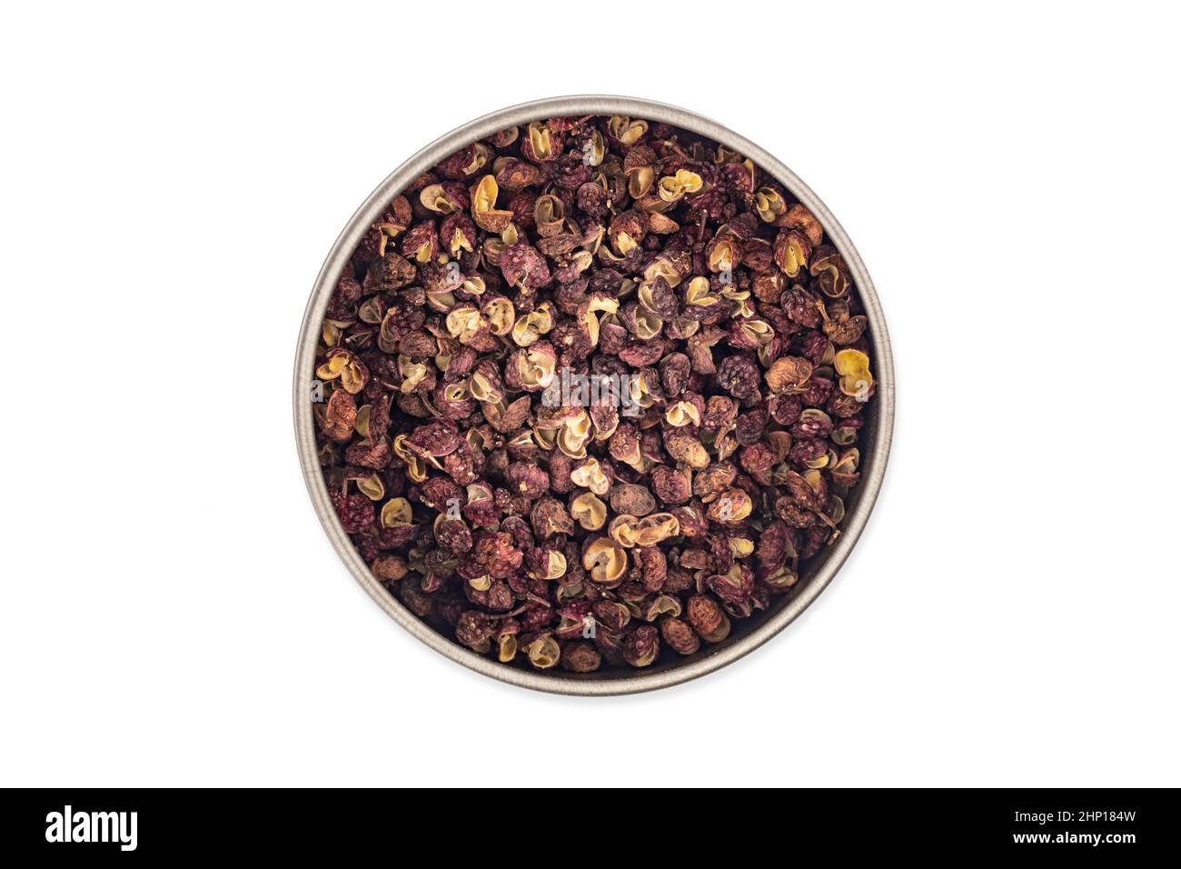Szechuan pepper in a bowl isolated over white background Stock Photo