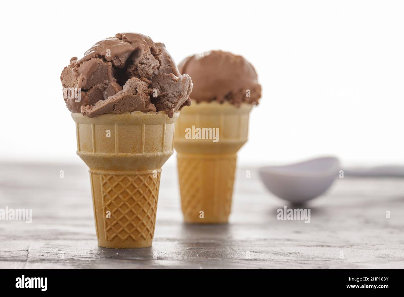 A close up of two chocolate ice cream cones. Stock Photo