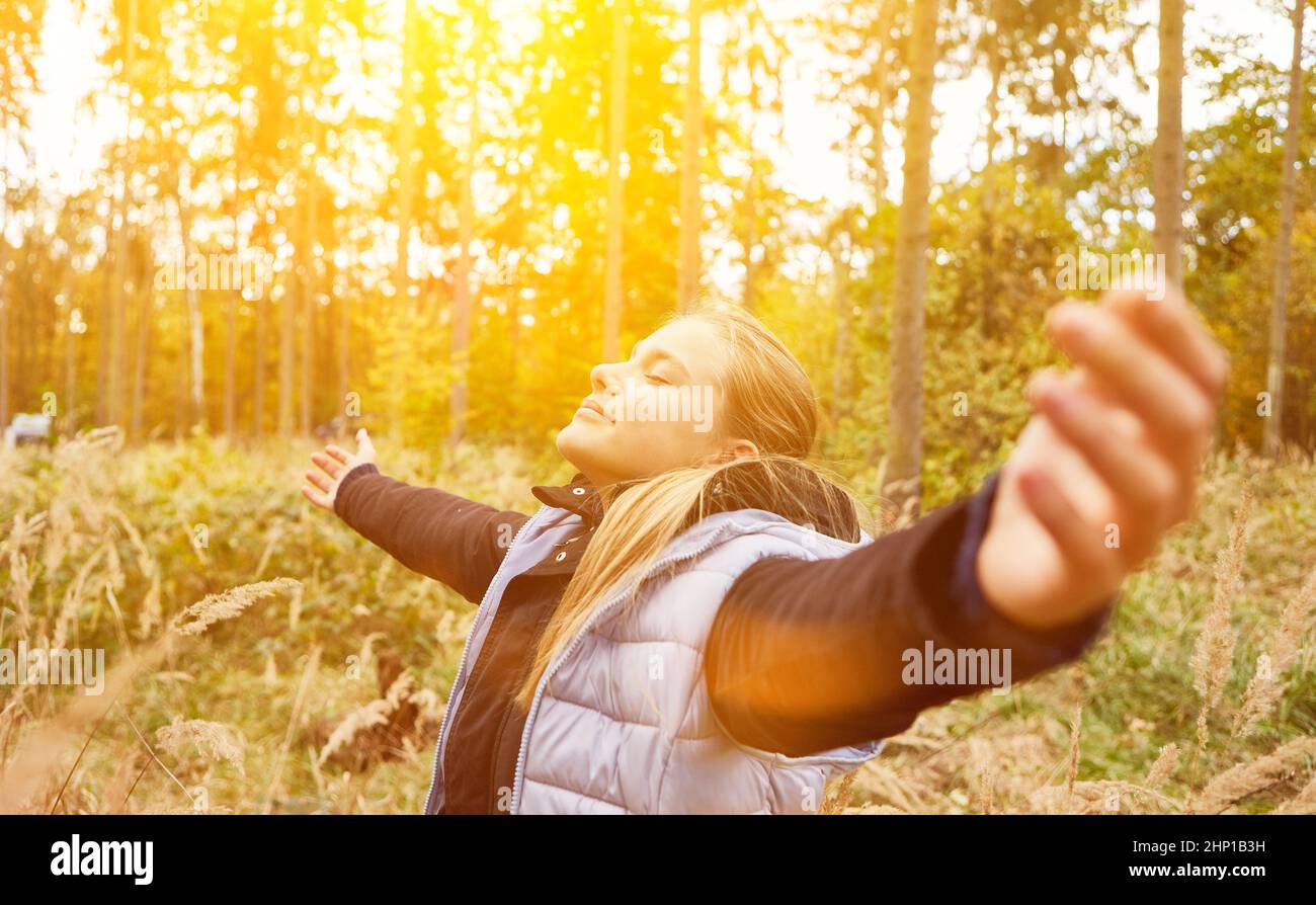 Girl Doing Breathing Exercise In The Forest While Breathing Fresh Air