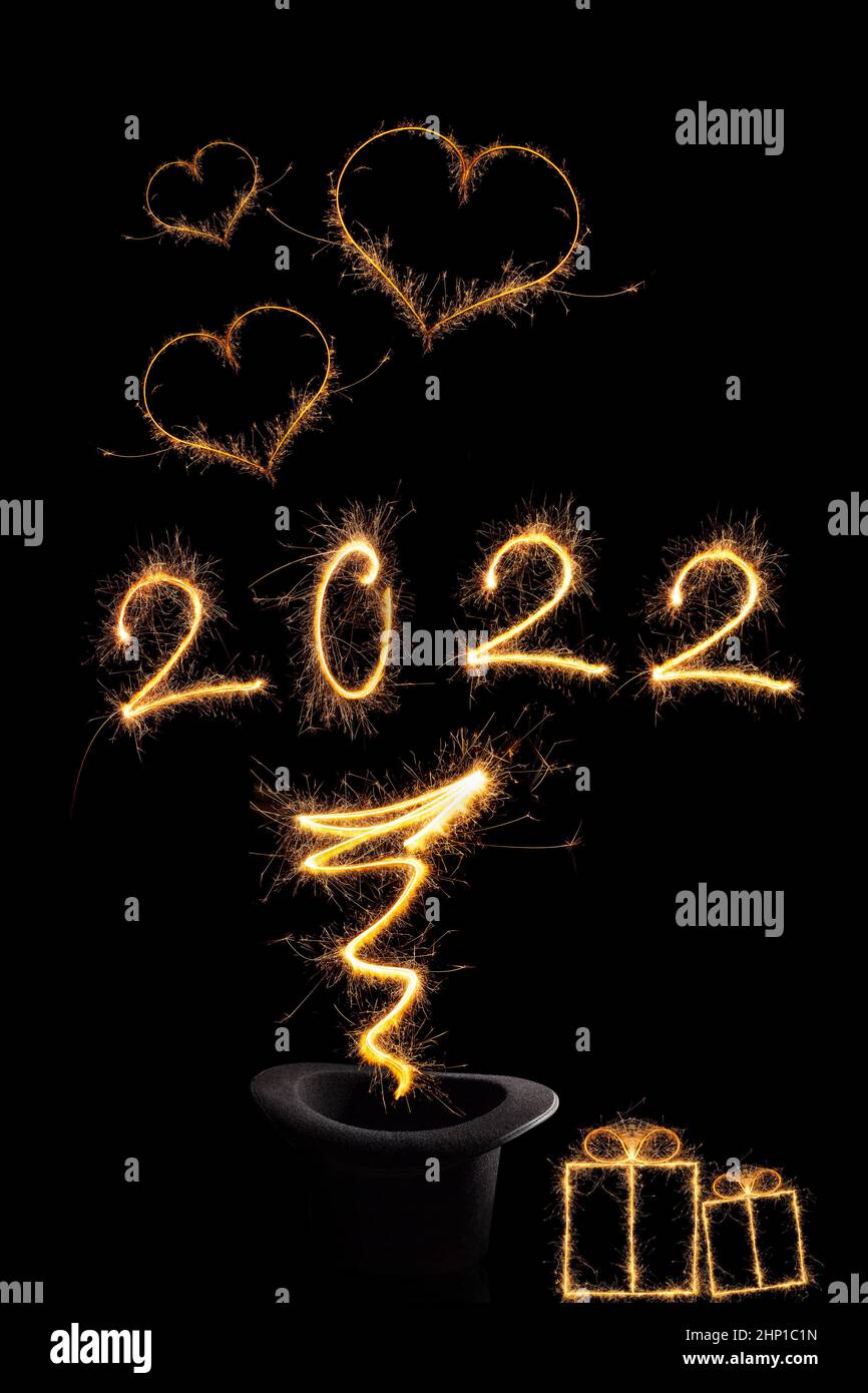 Magical new year. Magical fireworks forming number 2022. Happy new year background. Stock Photo