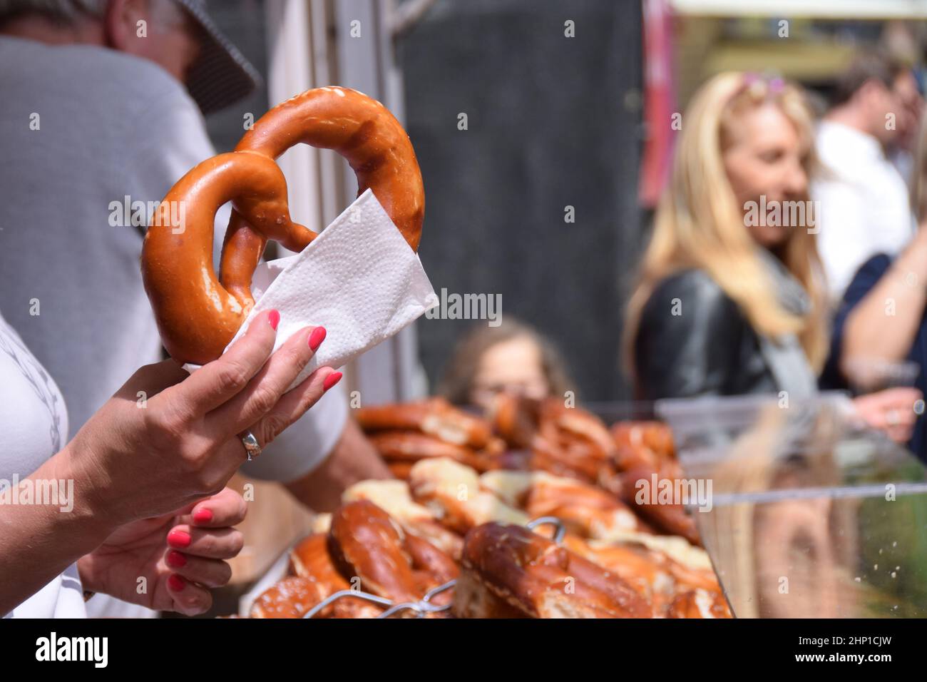 Selling a pretzel outdoors Stock Photo