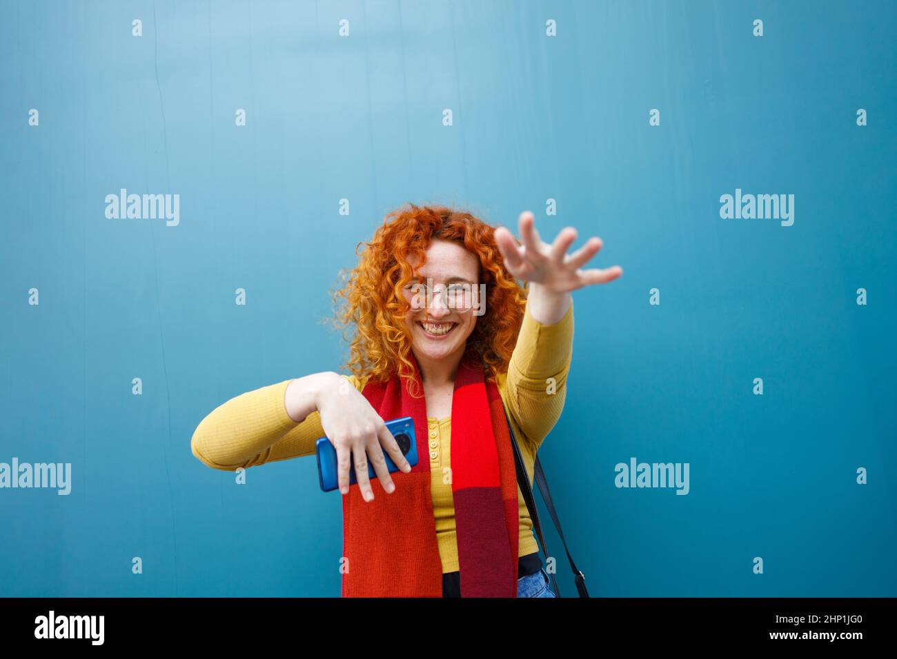 Young woman using mobile dancing hires stock photography and images