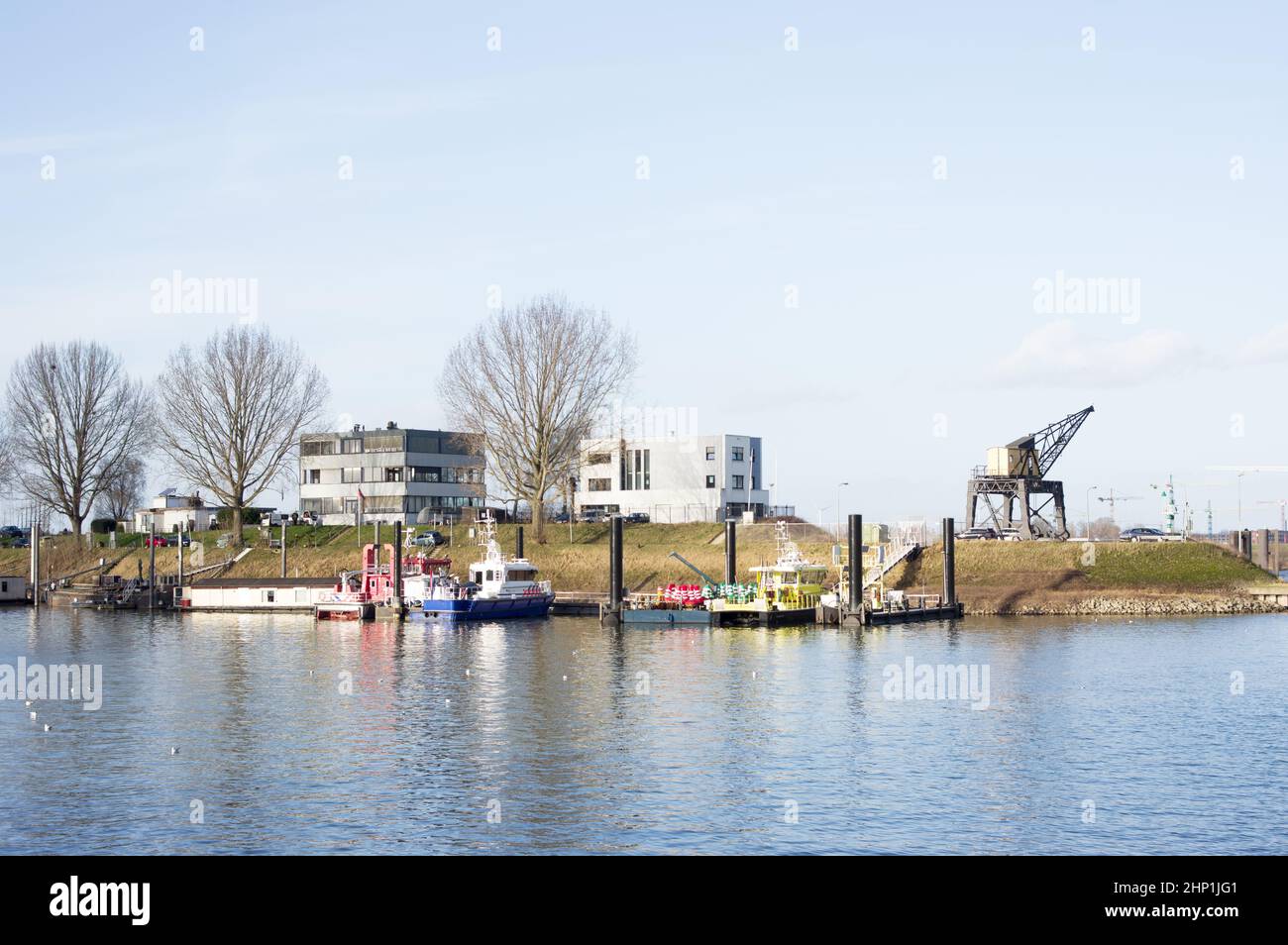 Small harbor with a police boat and a fire boat in Nijmegen in the Netherlands Stock Photo