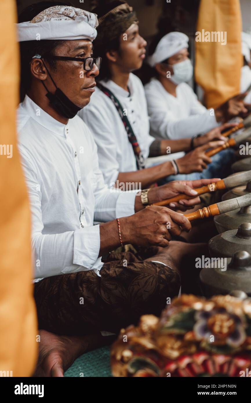 Balinese musicians playing traditional music during Hindu ceremony ...