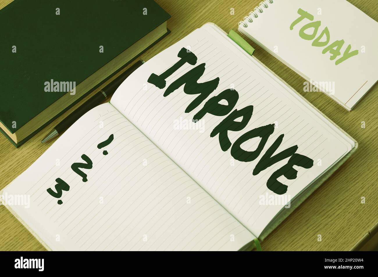 Handwriting text Improve, Internet Concept Make become better Development increase capacities Grow Change Plain Blank Open Notebooks With Stack Of Pen Stock Photo
