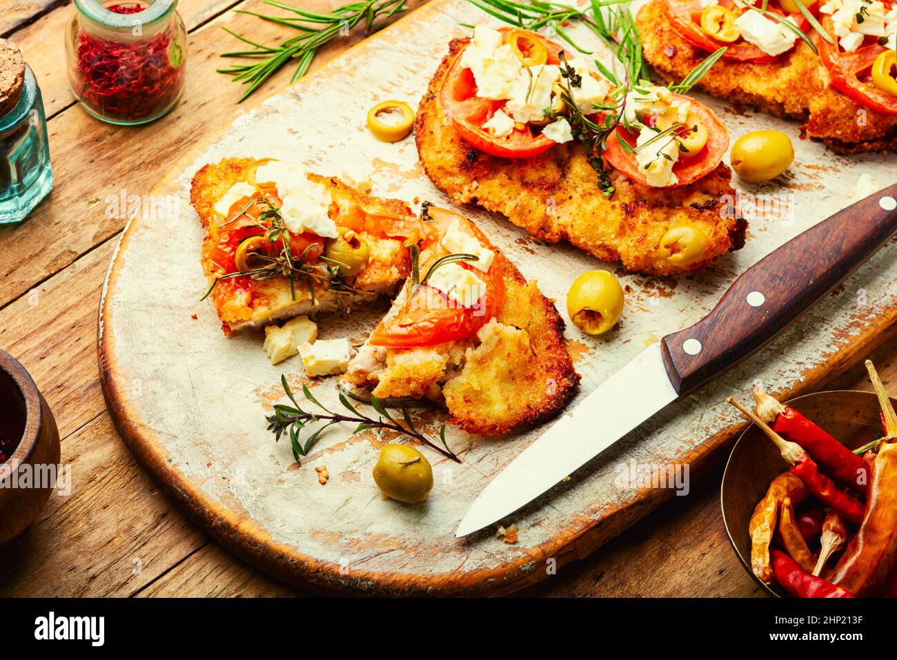 Schnitzel, breaded and fried thin layer of meat. Cretan schnitzel Stock ...