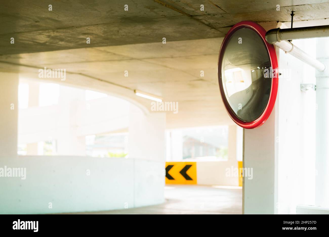 Convex safety mirror at curve of indoor car parking lot to reduce risk of  accidents from blind corner or blind spots. Convex circular safety mirror  in Stock Photo - Alamy