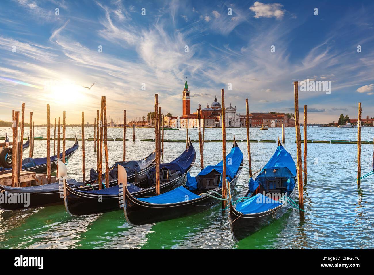 The island of San Giorgio Maggiore and traditional gondolas of Venice, Italy. Stock Photo